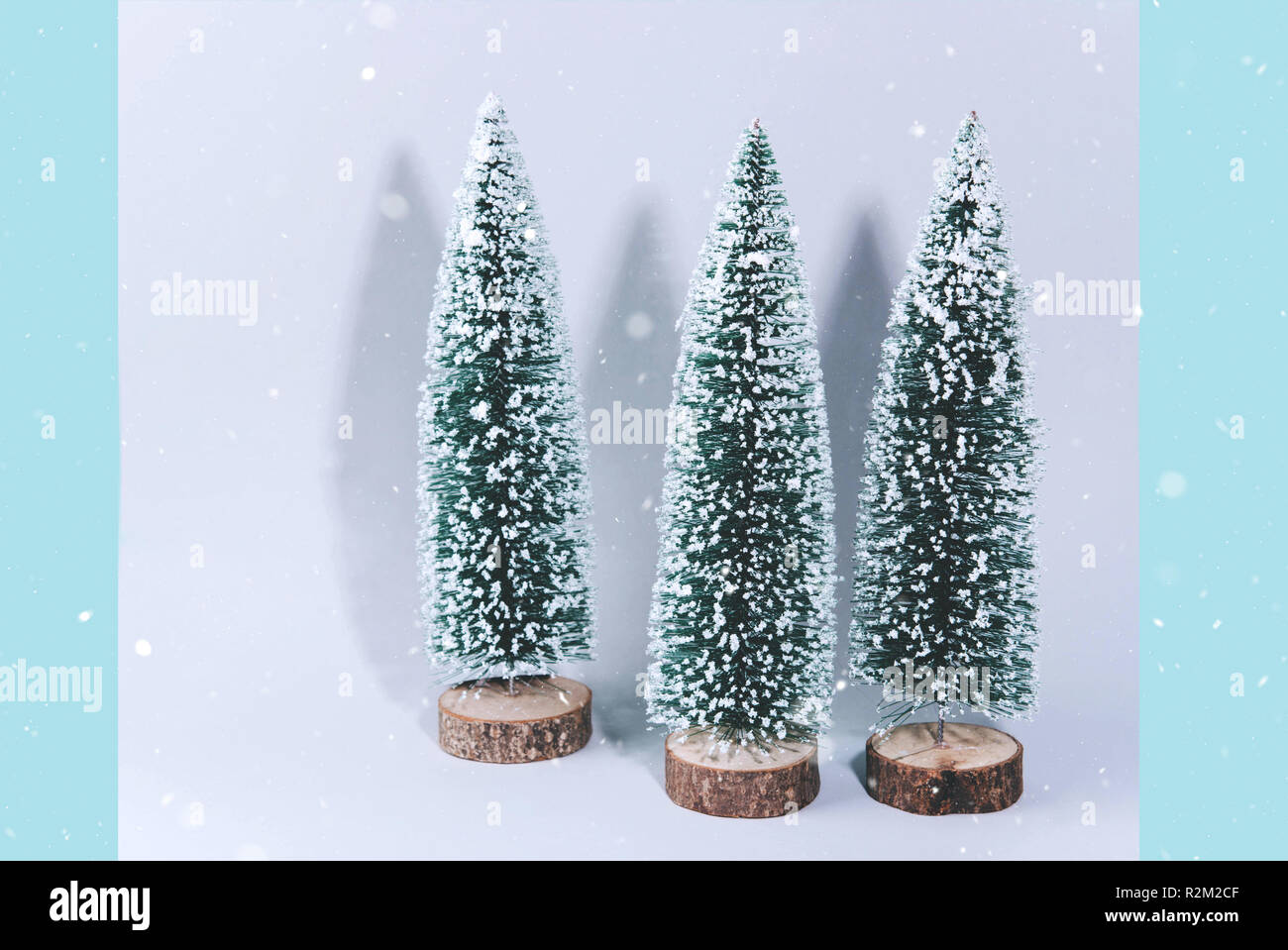 Christmas tree over light blue background Stock Photo - Alamy