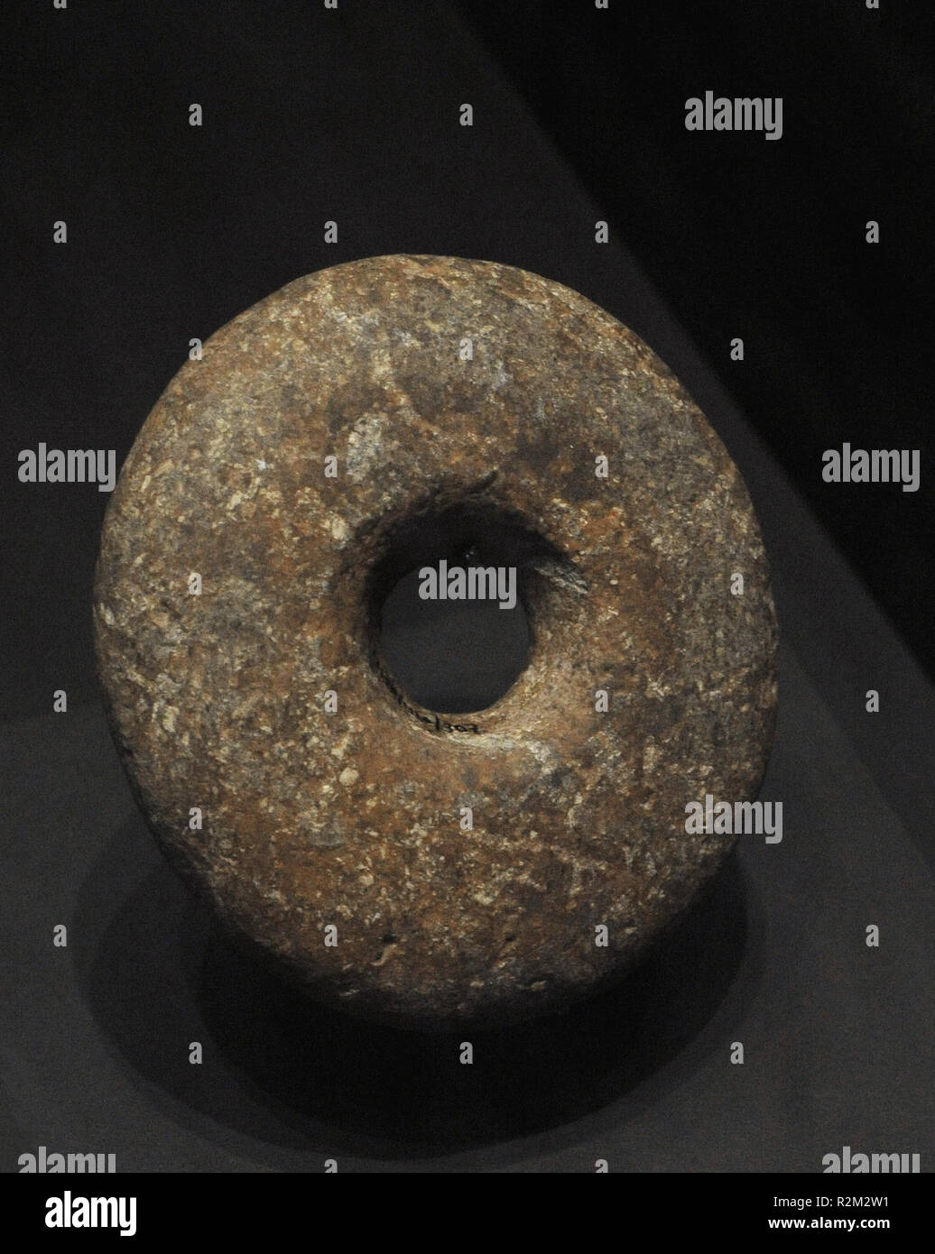 Neolithic. Stone weight from a digging stick. Limestone. From El Higueron Cave (Rincon de la Victoria, Malaga province, Andalusia, Spain). National Archaeological Museum. Madrid. Spain. Stock Photo