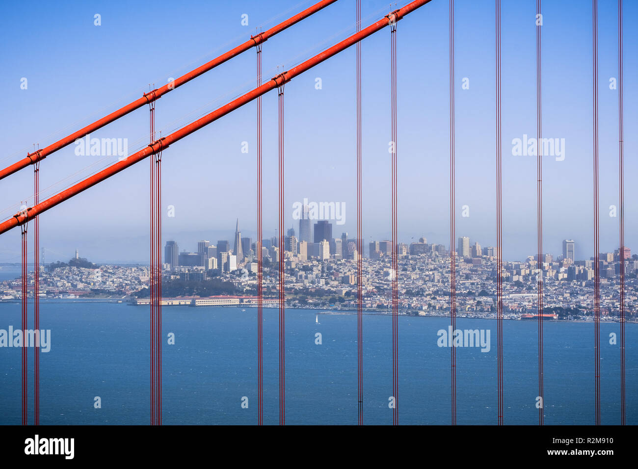 San Francisco's skyline viewed through the suspension cables of Golden