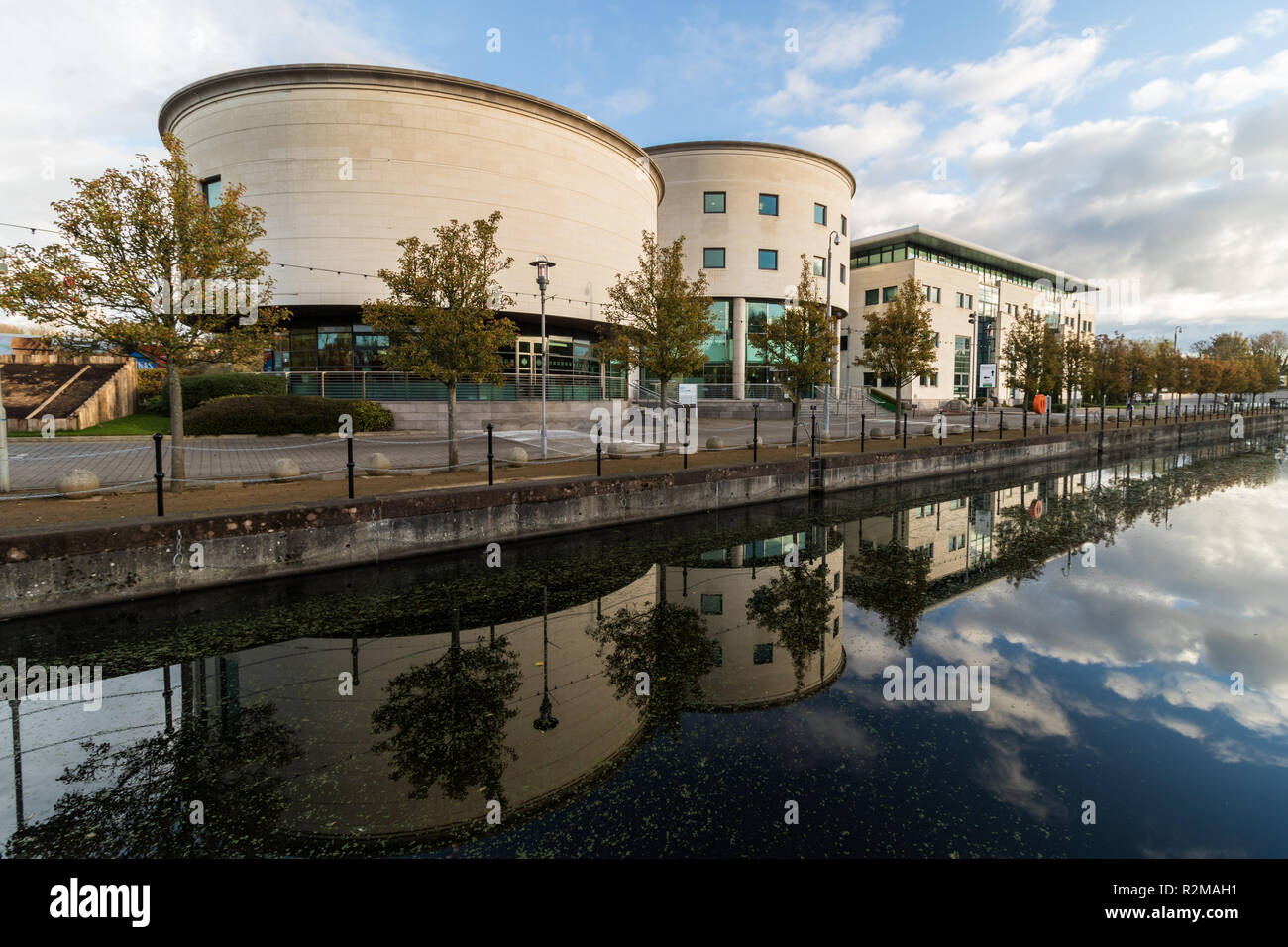 Civic Centre reflected in canal  at Lagan Valley Island, Lisburn, County Antrim, N.Ireland. Stock Photo