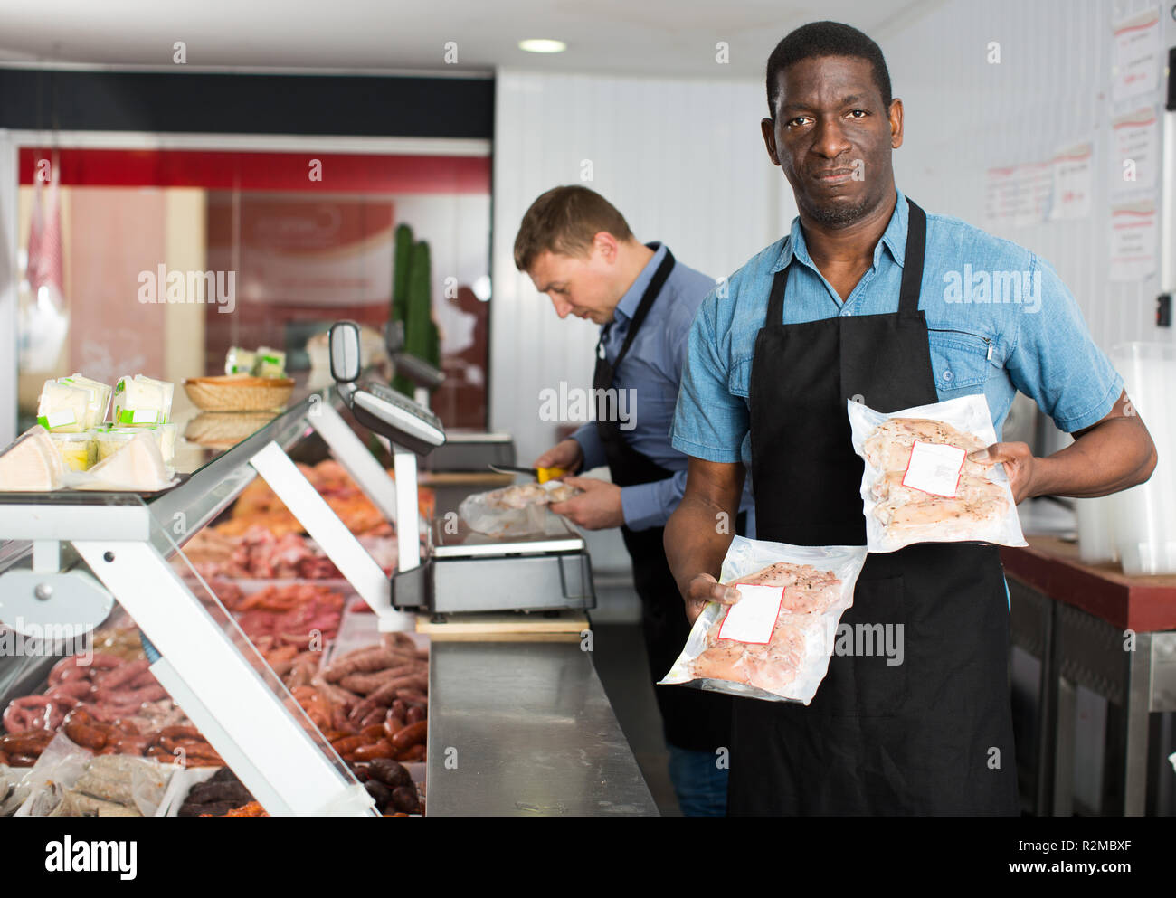 Butchers preparing minced meat hi-res stock photography and images - Alamy