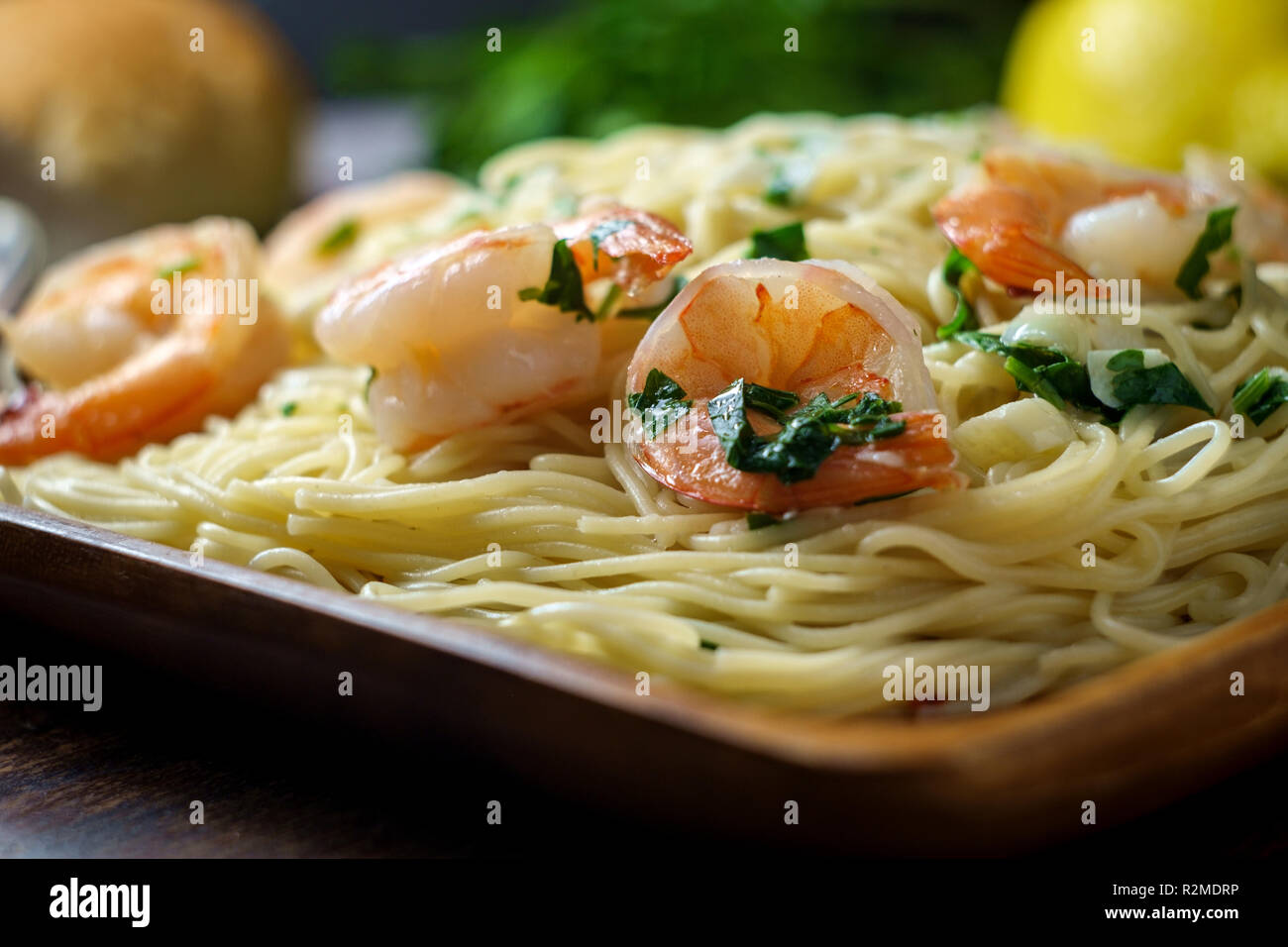 Shrimp Scampi With Angel Hair Pasta Surrounded By Cooking