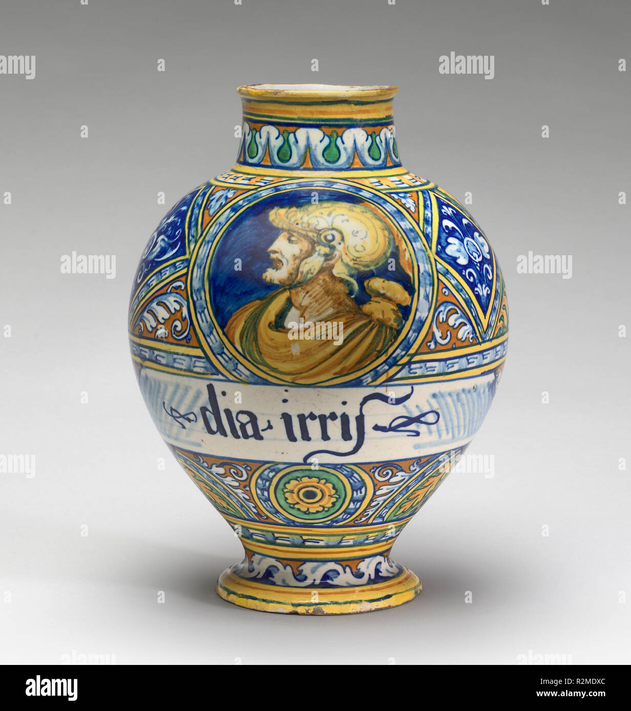Drug jar with the head of a warrior. Dated: c. 1540/1550. Dimensions: overall (height by widest diameter): 26.7 × 19.7 cm (10 1/2 × 7 3/4 in.). Medium: tin-glazed earthenware (maiolica). Museum: National Gallery of Art, Washington DC. Author: Faentine 16th Century. Stock Photo