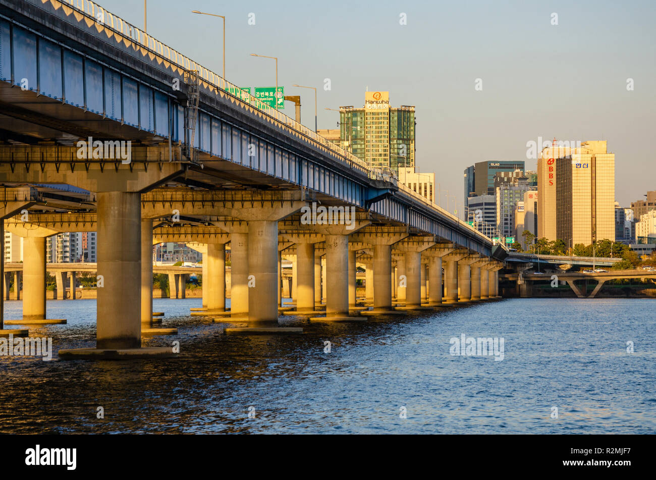 Passing underneath The Mapo Bridge which spans The River Han at Seoul in south Korea. Stock Photo