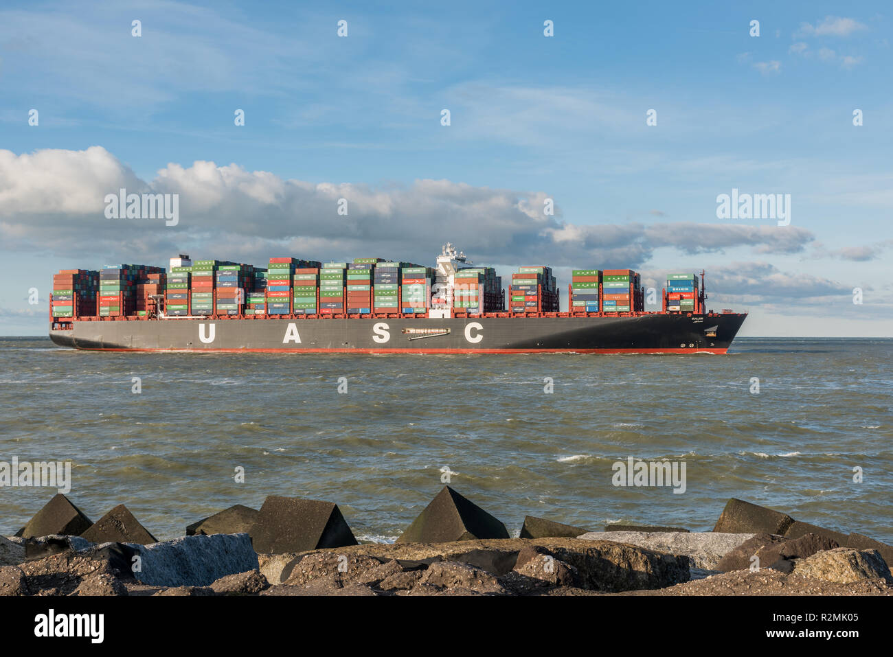 ROTTERDAM, THE NETHERLANDS - FEBRUARY 28, 2016: The ultra large container ship Sajir of UASC arrives at the Maasvlakte, Port of Rotterdam  on February Stock Photo