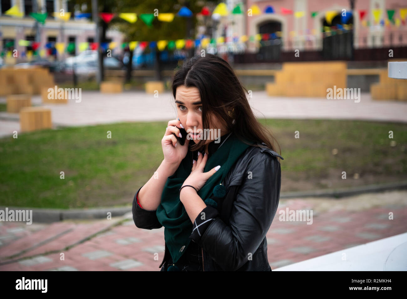 Woman with serious expression talking on telephone. Stock Photo