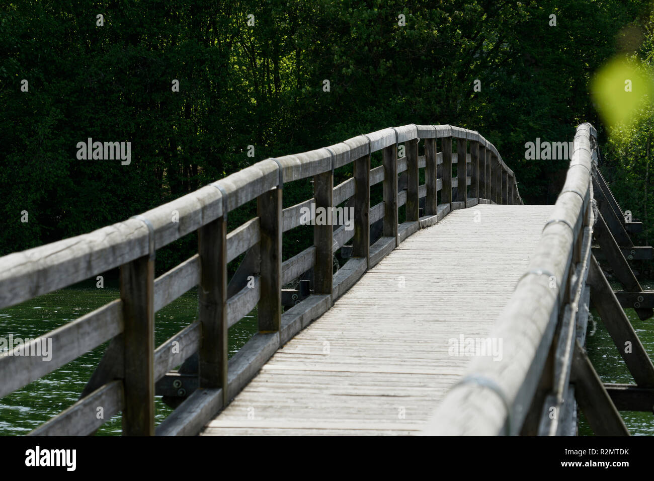 Person walks across narrow bridge hi-res stock photography and images ...