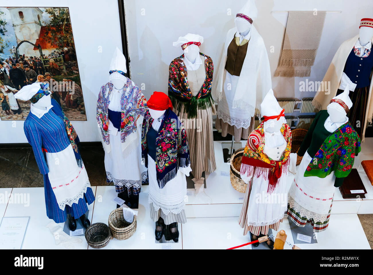 Latvian traditional costumes. Exhibition of Arts and crafts "Creative Dominance". National cultural identity. St. Peter's Church is a Lutheran church  Stock Photo