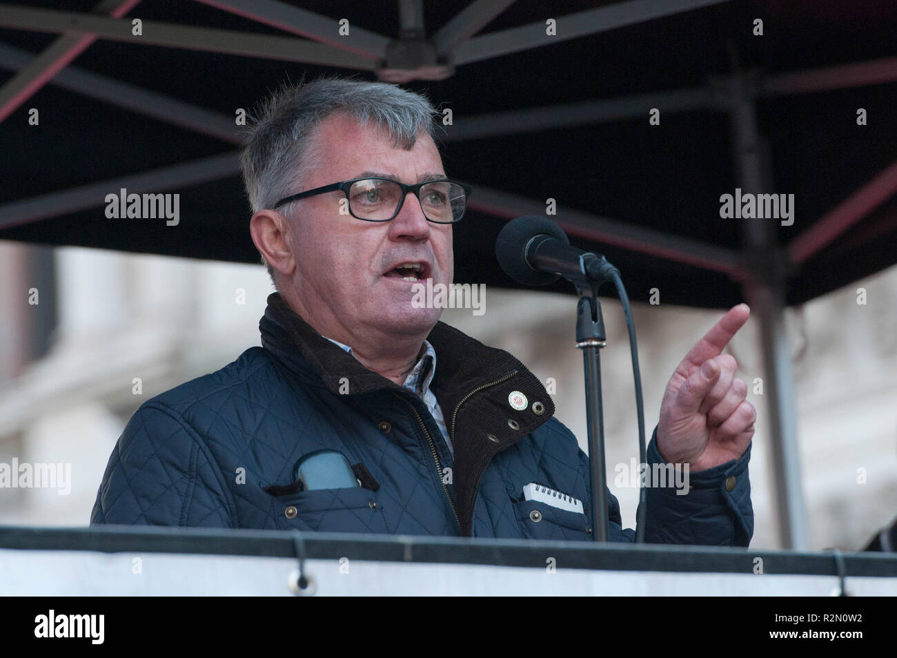 General Secretary of the National Union of Rail, Maritime and Transport Workers Mick Cash seen speaking during the protest. Huge crowds marched from the BBC in Portland Place to Whitehall with flags and placards during the National Unity Demonstration to oppose the rise of fascist and racist activity in Europe, The demonstration was called by Unite against Fascism, Love Music Hate Racism and Stand up to racism movements. The speeches in Whitehall were disrupted by the presence of a small number of far right activists and Trump supporters. Stock Photo