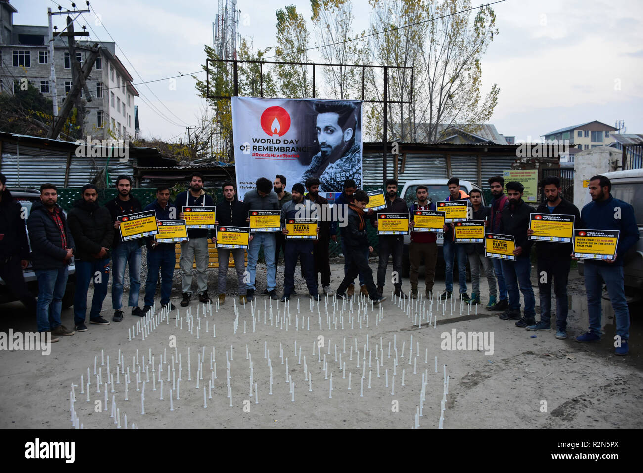 November 18, 2018 - A large crowd of people attend a vigil to remember the victims of road accidents in Srinagar, in Indian administered Kashmir on the occasion of the World Day of Remembrance for Road Traffic Victims on 18th November 2018. Participants hold banners calling for the government to make and enforce good roads safety laws, to ensure roads and vehicles are safe, and to provide prompt emergency care for road traffic victims. According to the Indian ministry of road transport and highways, the Indian State of Jammu and Kashmir ranks second across India for road accidents, with an ave Stock Photo