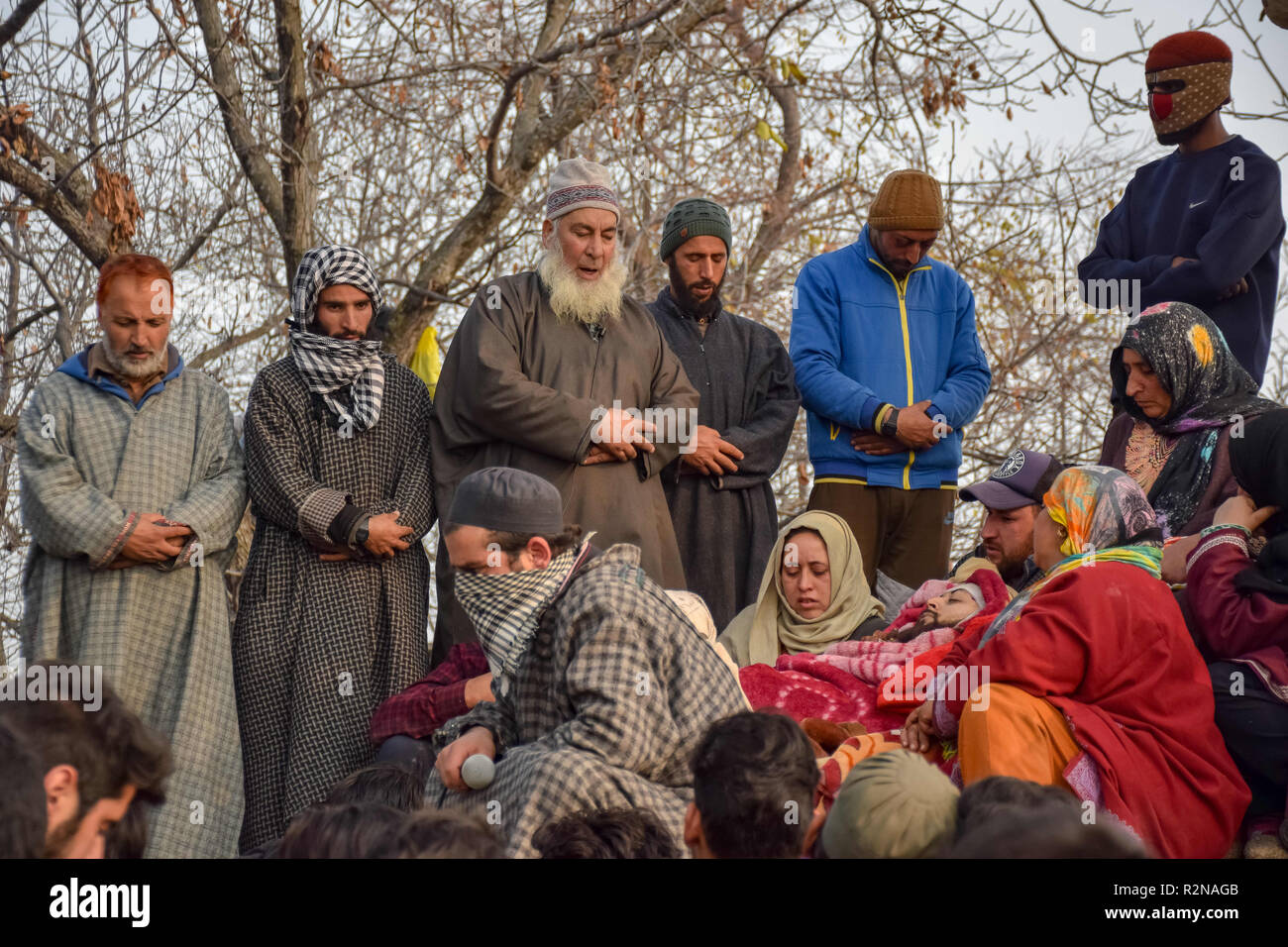 November 20, 2018 - Shopian, Jammu & Kashmir, India - (EDITORS NOTE: Image depicts death.).Kashmiri Muslims are seen offering funeral prayers for the slain militant Abid Nazir Wagay during his funeral procession.Thousands of Kashmiri Muslims attend the funeral procession of the slain Militant Abid Nazir Wagay at his residence Paddarpora in south Kashmir's Shopian district some 80 Kms from summer capital of Srinagar, Abid was killed along with his three associates in a gunfight with Government forces at Nadigam village Shopian and an Indian trooper also killed during the gunfight. (Credit Imag Stock Photo