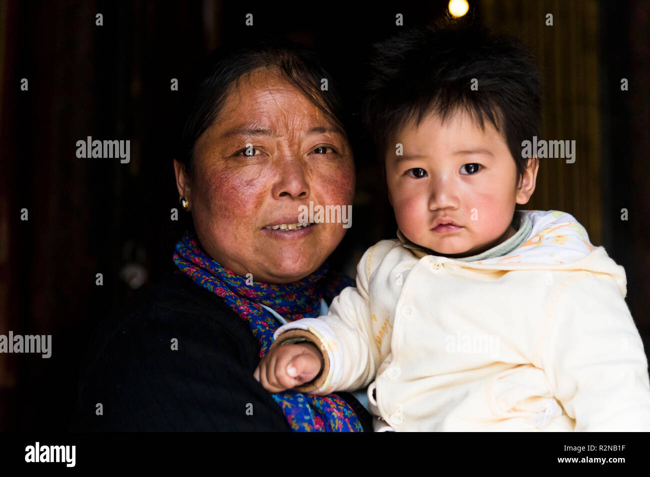 Mother and child in Nyethang Monastery, portrait Stock Photo
