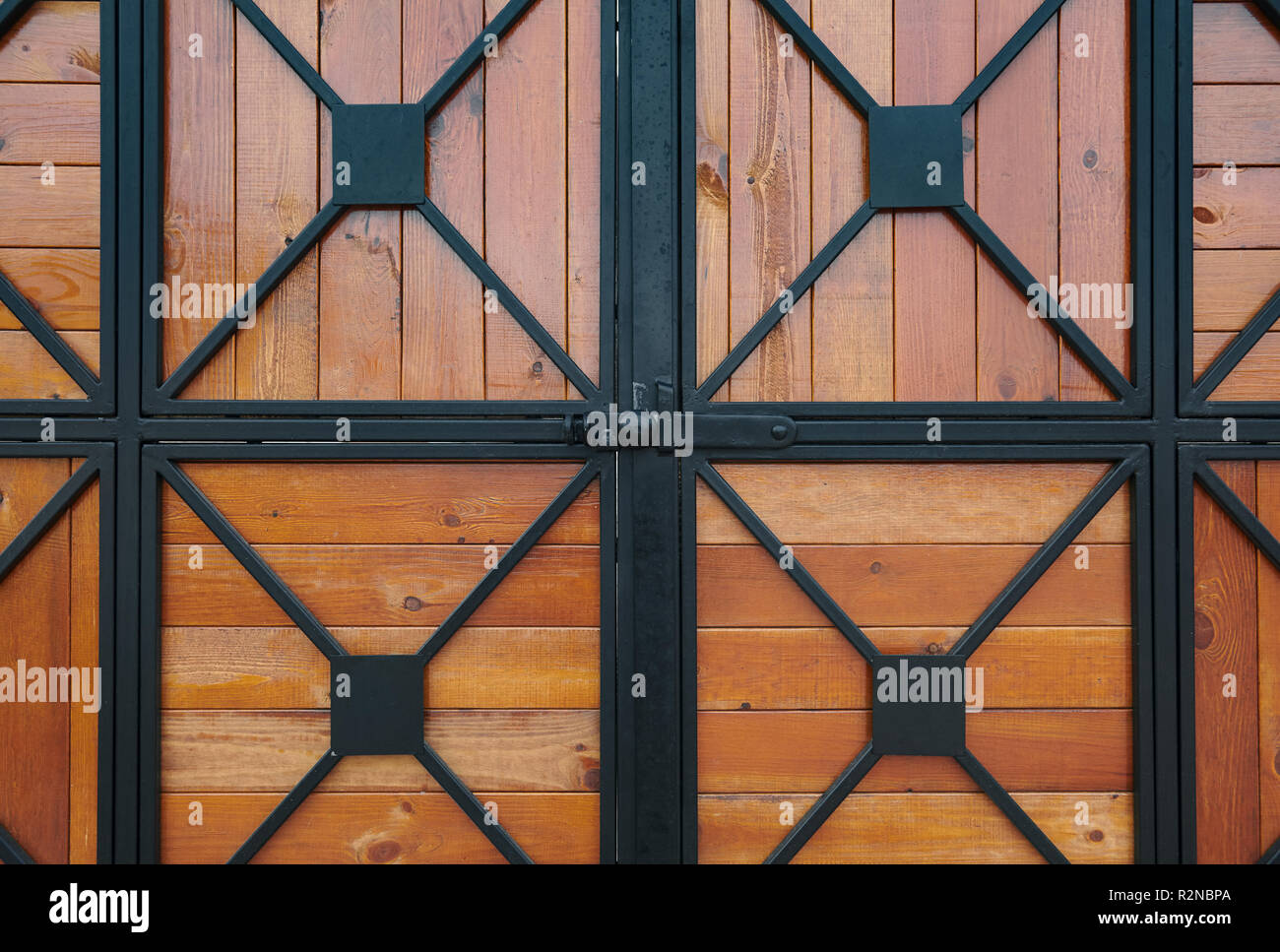 wooden gate with wrought iron as background Stock Photo - Alamy