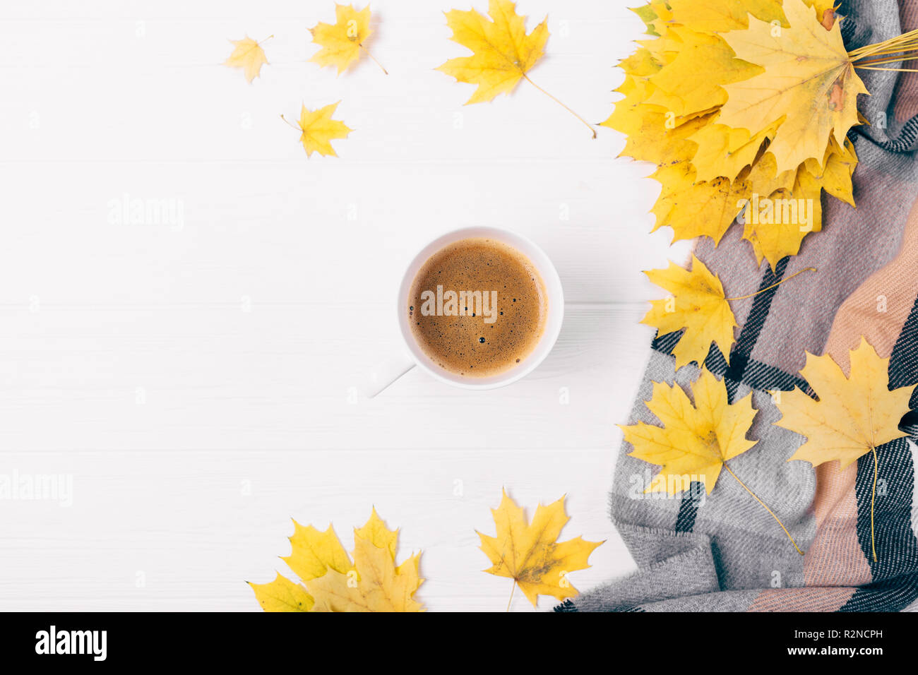 Flat lay cup of coffee among side composition of autumn leaves and ...