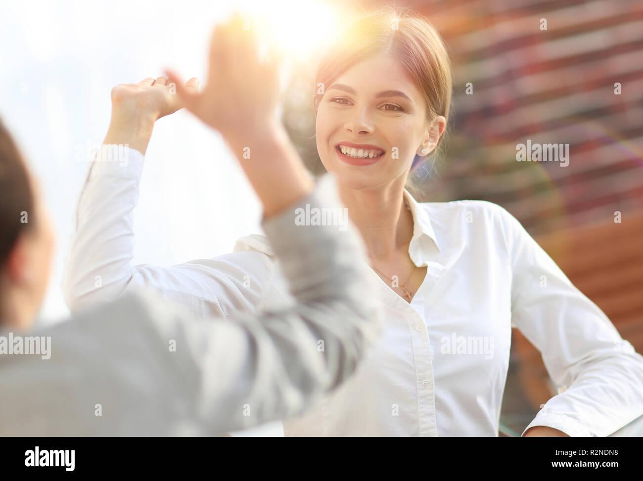members of the business team giving each other a high five Stock Photo ...