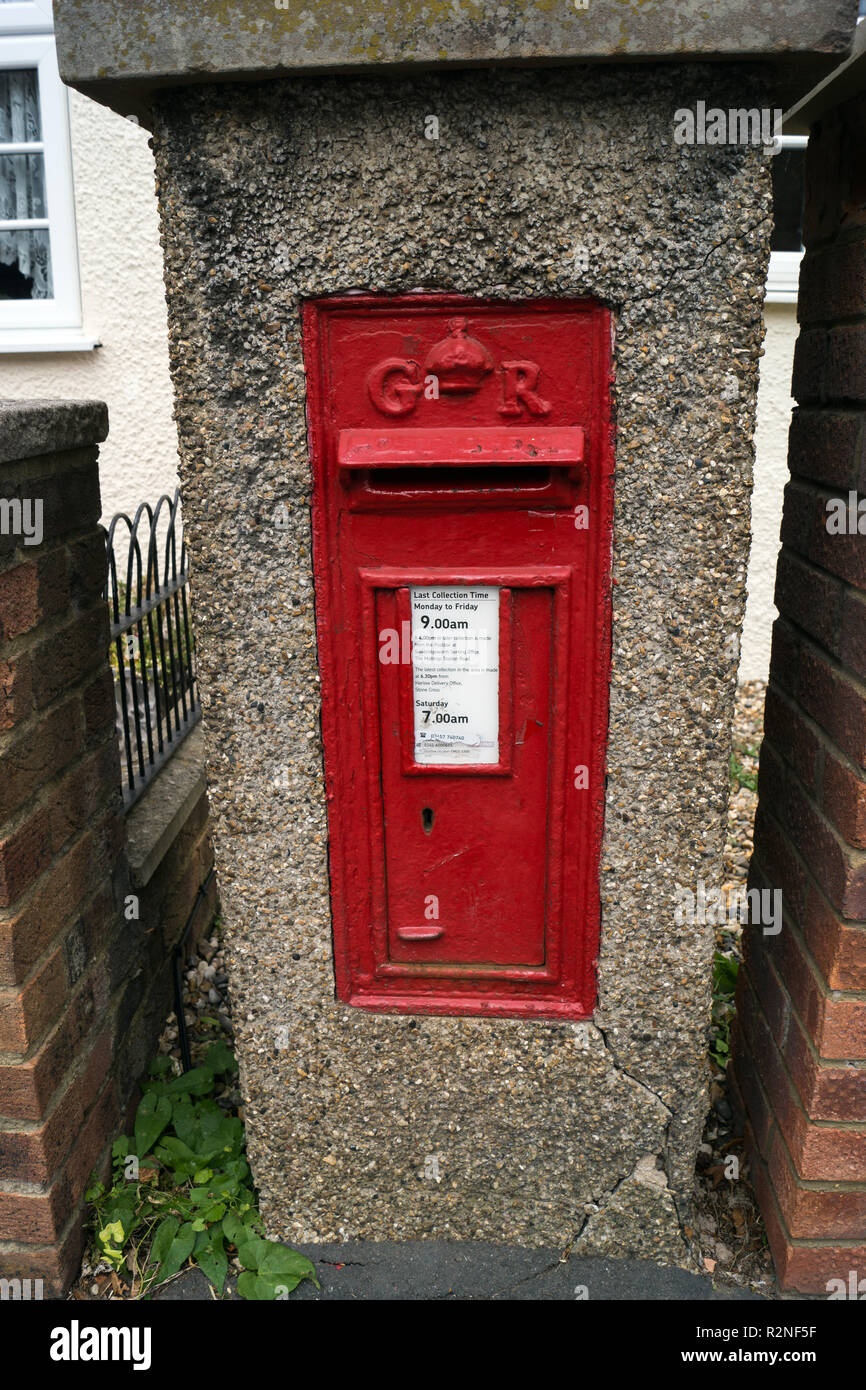 A concrete mounted Royal mail collection box in Lower Sheering, Essex from the reign of King George VI, ER, in a concrete render. Stock Photo