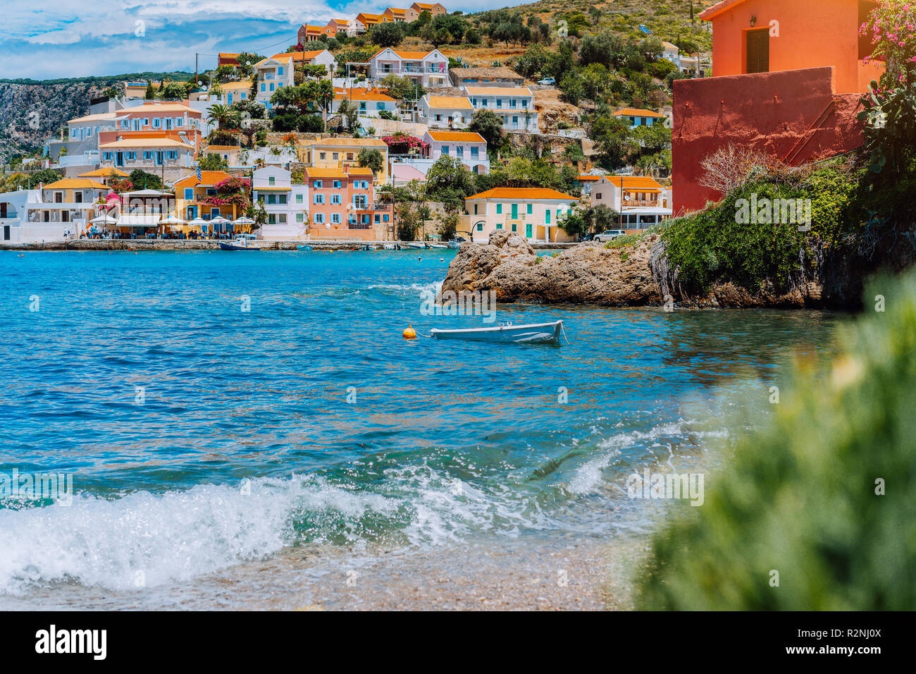 Beautiful sailing yacht near picturesque seacoast. Assos village Mediterranean  Sea, Greece. Summer vacation on Greek Island Stock Photo - Alamy