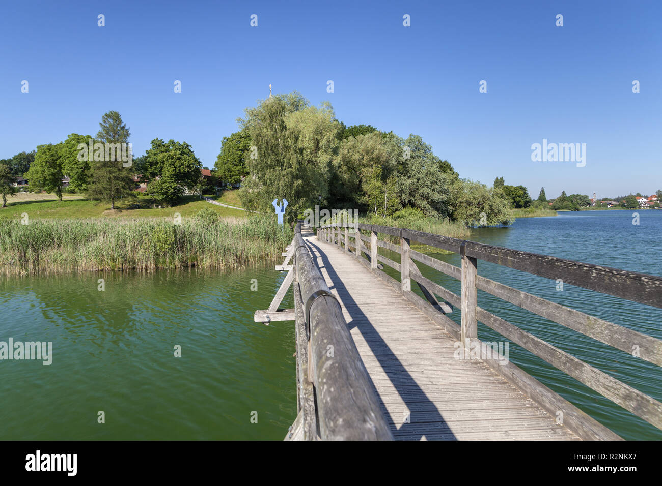 Jetty over Seeoner See to Seeon Abbey, Seeon-Seebruck, Chiemgau, Upper Bavaria, Bavaria, Southern Germany, Germany, Europe Stock Photo