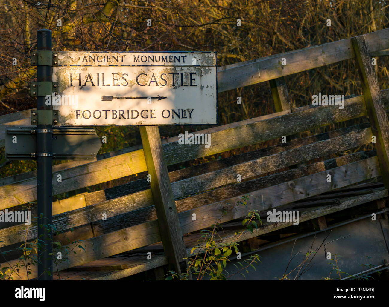 Ancient monument direction sign to Hailes castle over footbridge, East Lothian, Scotland, UK Stock Photo