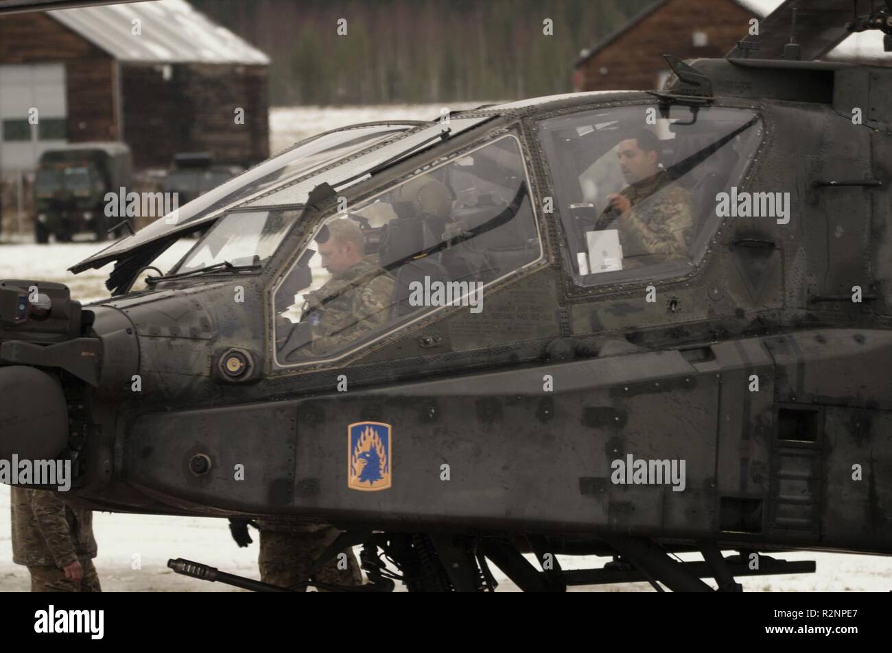 From Left To Right U S Army Apache Helicopter Pilots Chief Warrant Officer 2 Steven Stocking And Chief Warrant Officer 3 Emmanuel Sanchez Assigned To 1st Battalion 3rd Aviation Regiment 12th Combat Aviation
