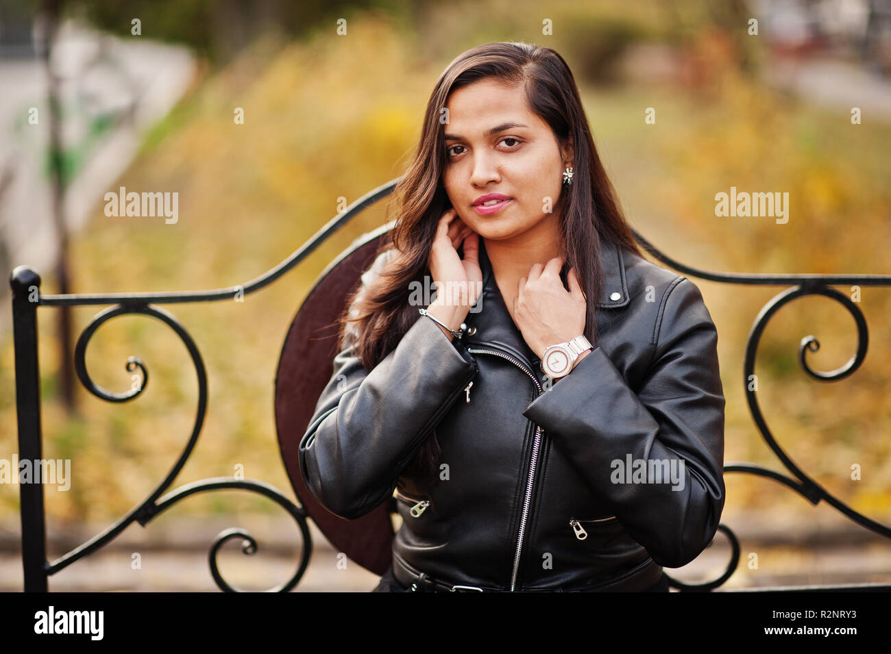 Pretty indian girl in black saree dress and leather jacket posed ...