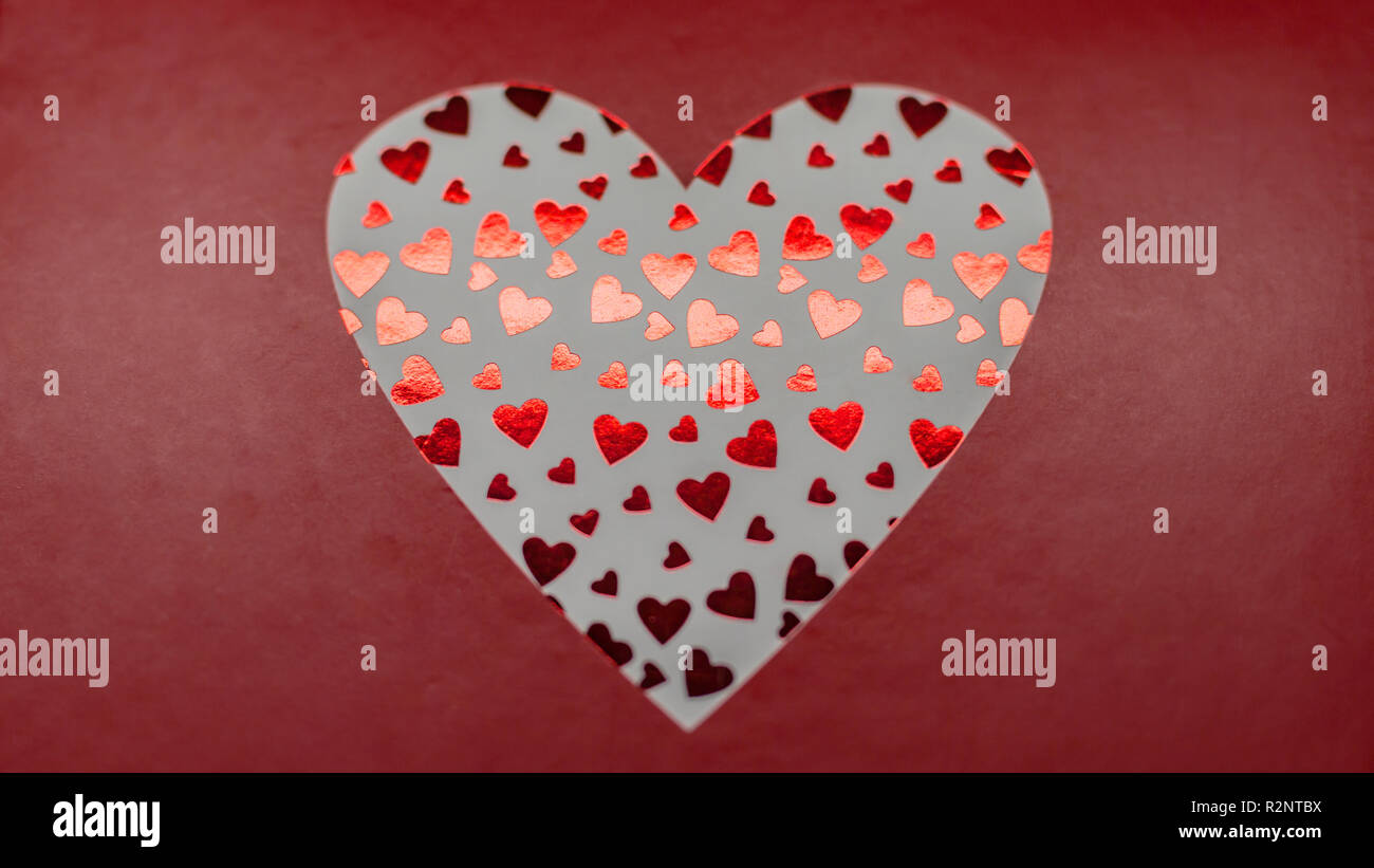 Artistic red hearts on red frame Stock Photo