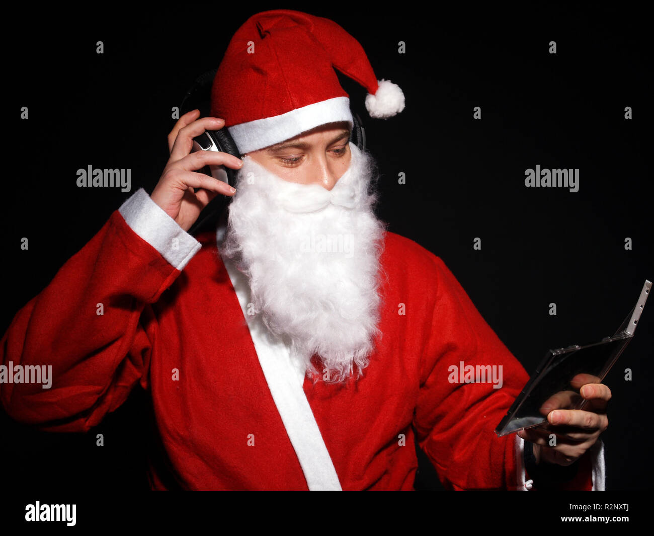 santa-claus-is-listening-to-music-stock-photo-alamy