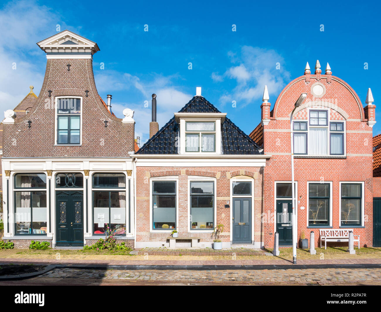 Front view of three historic houses in old town of Workum, Friesland, Netherlands Stock Photo