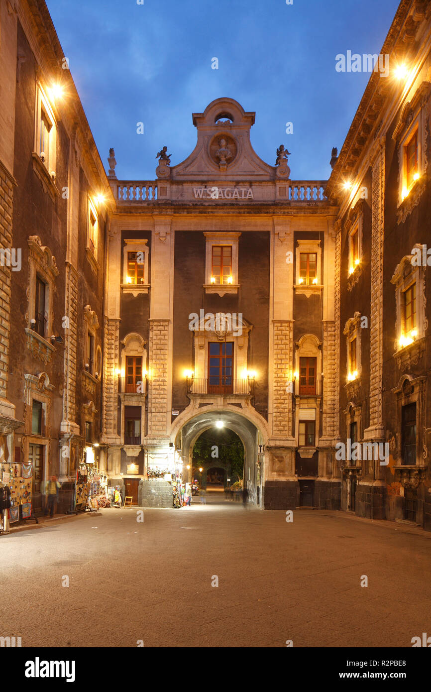 Via Etnea with Porta Uzeda Gate at dusk, old town, Catania, Sicily, Italy, Europe Stock Photo