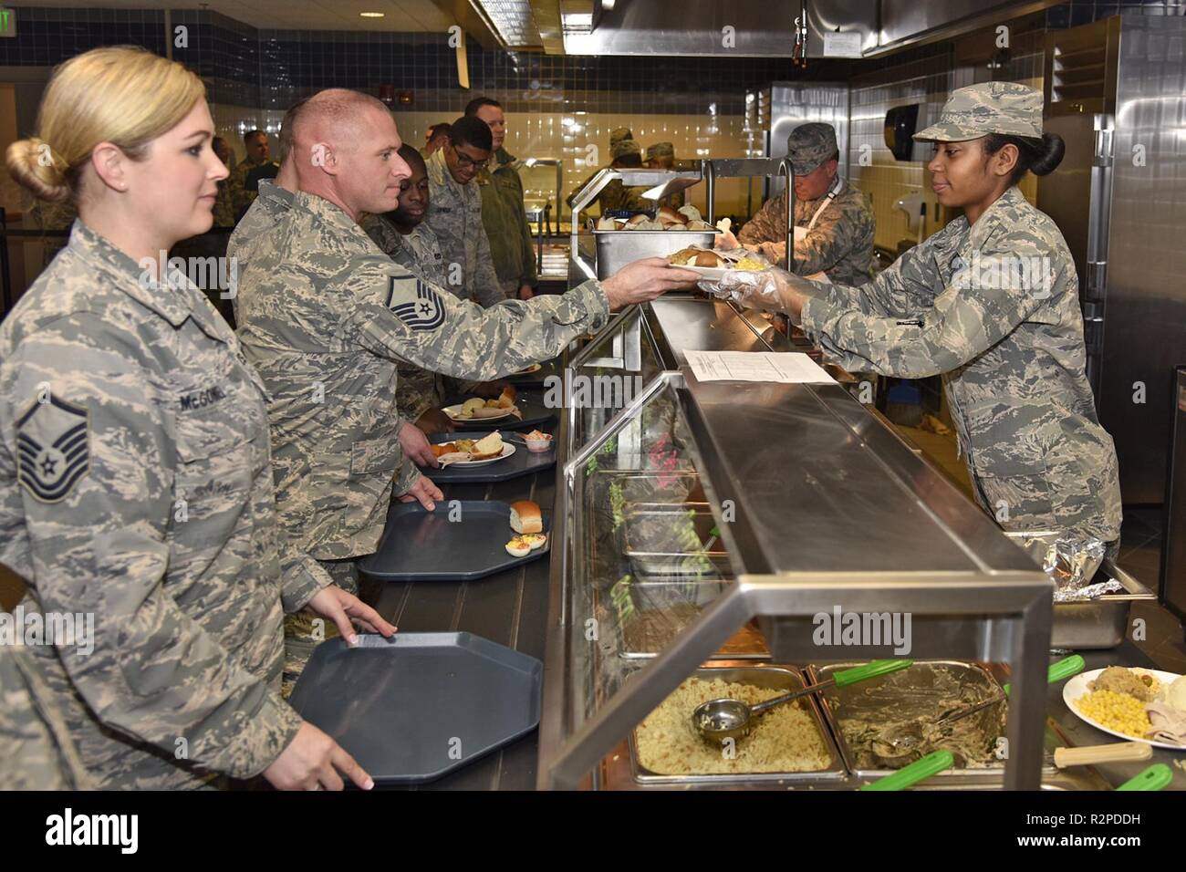 Members of the 127th Force Support Squadron hand out meals during the November drill in the dining facility at Selfridge Air National Guard Base, Mich., Nov. 3, 2018. Every year with help from the first sergeants, chief master sergeants and squadron commanders, the 127th FSS provides a Thanksgiving-day-themed meal for Selfridge Airmen. Stock Photo