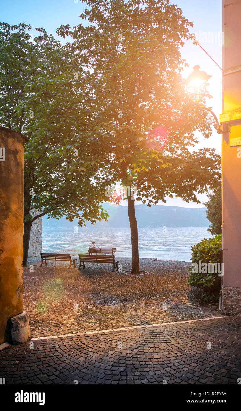 Bench man lake garda italy hi-res stock photography and images - Alamy