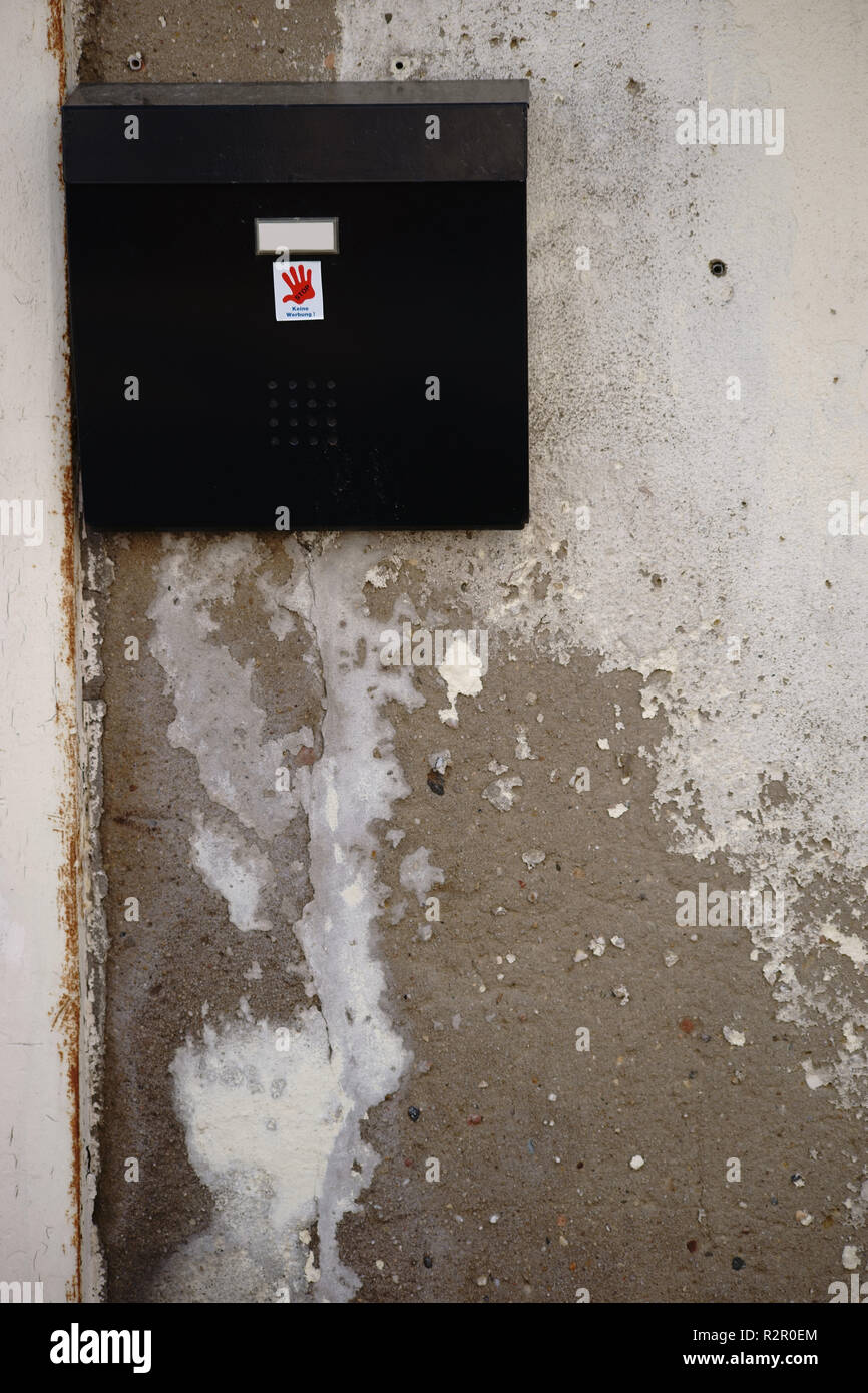 Exterior wall, paint falling off, mailbox Stock Photo