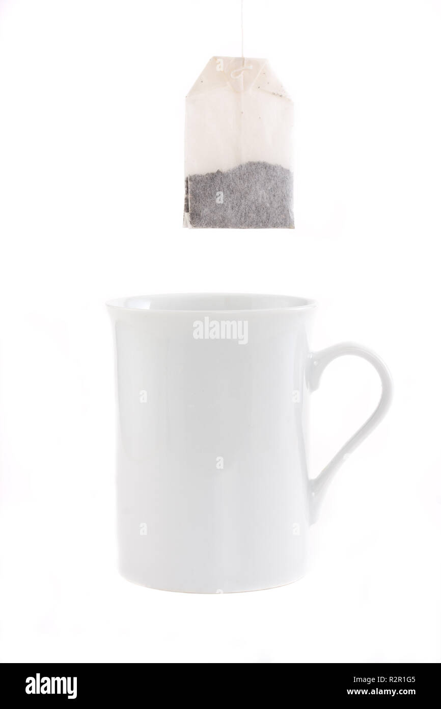 teabag and a white cup isolated on white background Stock Photo