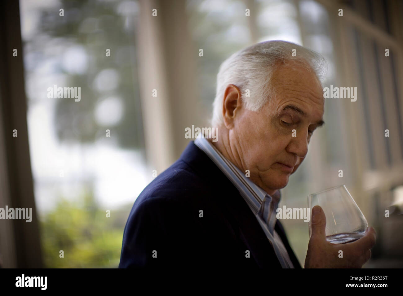 elderly man drinking wine Stock Photo