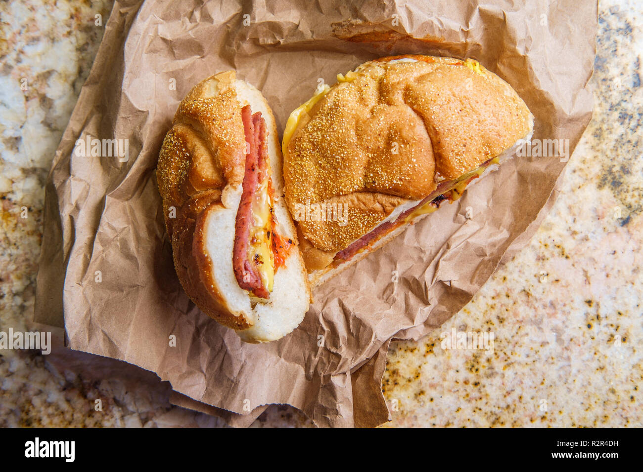 Taylor ham, pork roll, egg and cheese breakfast sandwich on a kaiser