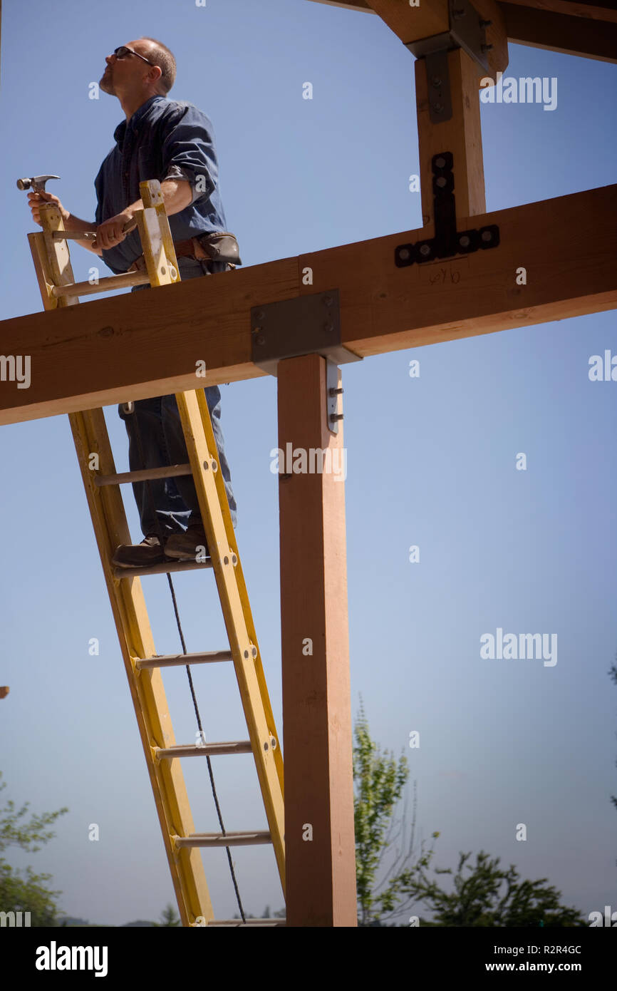 Focused builder working on a construction site. Stock Photo