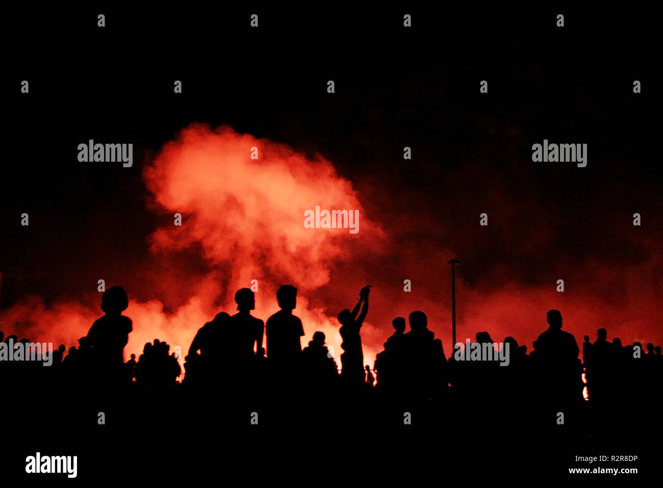 people are watching explosions Stock Photo