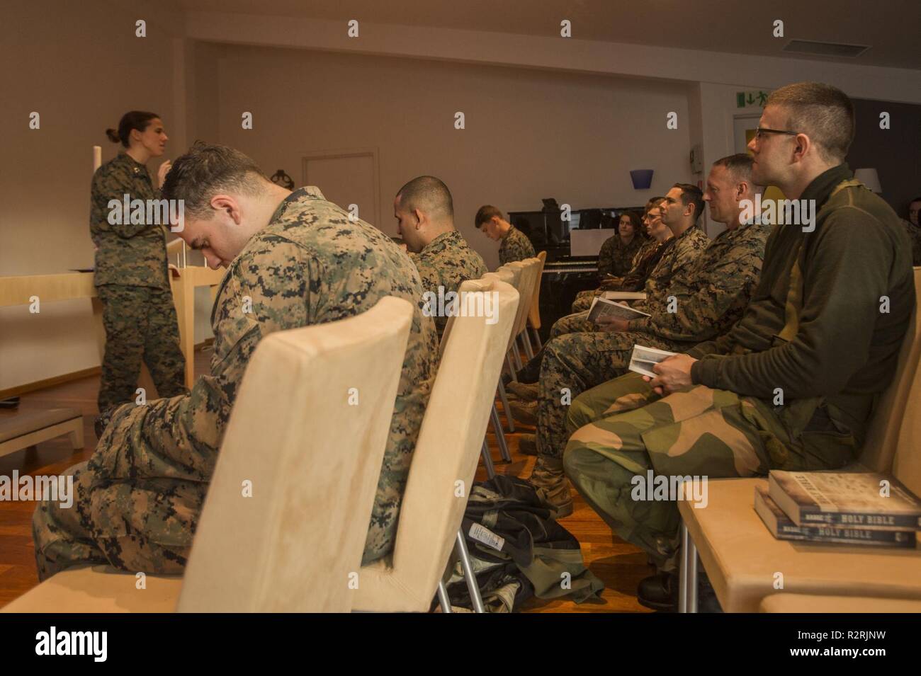 U.S. Marines, Sailors, and Norwegian soldiers take part in religious services during Exercise Trident Juncture 18 at Vaernes Air Station, Norway, Nov. 4, 2018. Trident Juncture 18 enhances the U.S. and NATO Allies’ and partners’ abilities to work together collectively to conduct military operations under challenging conditions. Stock Photo
