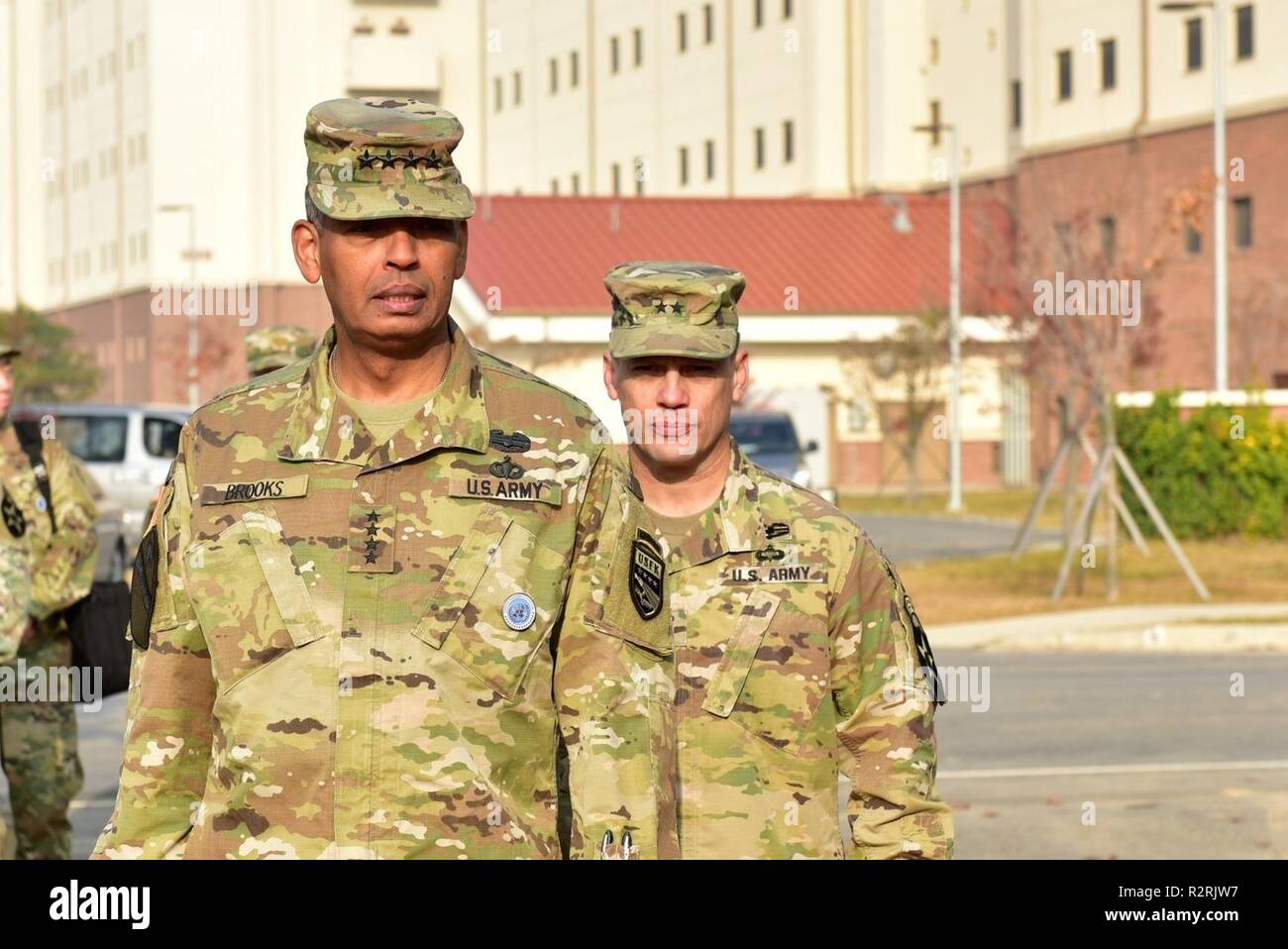 CAMP HUMPHREYS, Republic of Korea – Gen. Vincent K. Brooks, Anchorage, Alaska native, and commanding general, United Nations Command/Combined Forces Command/United States Force Korea, and Maj. Gen. D. Scott McKean, San Jose, California native, and commanding general, 2nd Infantry Division/ROK-U.S. Combined Division, arrive at the 2ID Regimental Walk Ceremony to unveil the 9th Infantry Regiment stone marker at the new division headquarters Nov. 5. Brooks served as a former commander of 2nd Battalion, 9th Infantry (Manchu) Regiment and dedicated the first marker, demonstrating his connection to  Stock Photo