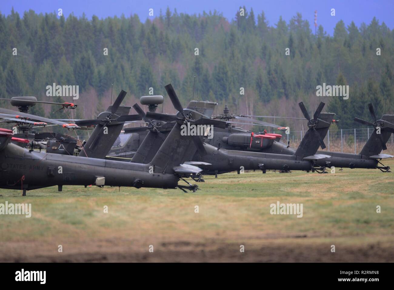 U.S. Army Apache helicopters assigned to 12th Combat Aviation Brigade, sit at Rena Leir Airfield, Norway, during Trident Juncture 18, Nov. 4, 2018. Trident Juncture is a NATO-led military exercise held in Norway. The exercise is the largest of its kind in Norway since the 1980s. An expected 51,000 participants from over 30 nations will take part, including 10,000 vehicles, 150 aircraft and 60 vessels. The main goals of Trident Juncture is to train the NATO Response Force and to test the alliance's defense capabilities. Stock Photo