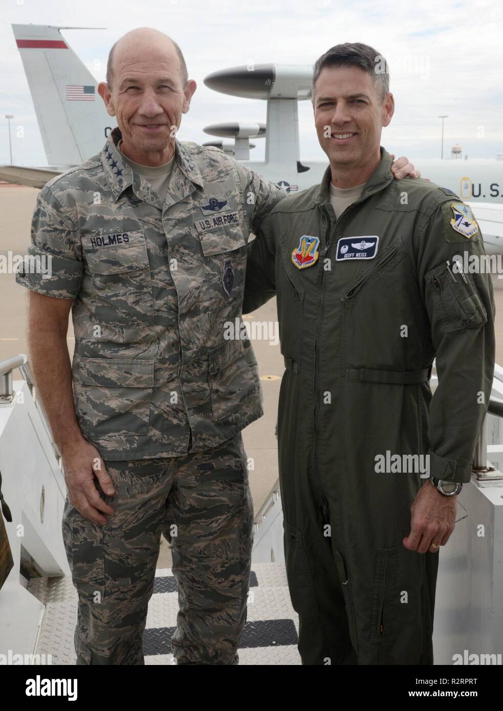 Gen. Mike Holmes, the commander of Air Combat Command, posed for a quick picture with 552nd Air Control Wing commander Col. Geoffrey Weiss and several E-3 Sentry aircraft in the background. Holmes visited Tinker Nov. 1, 2018, and was able to tour several 552 ACW operational and maintenance facilities to gain an overview of their mission, successes and innovations. Stock Photo