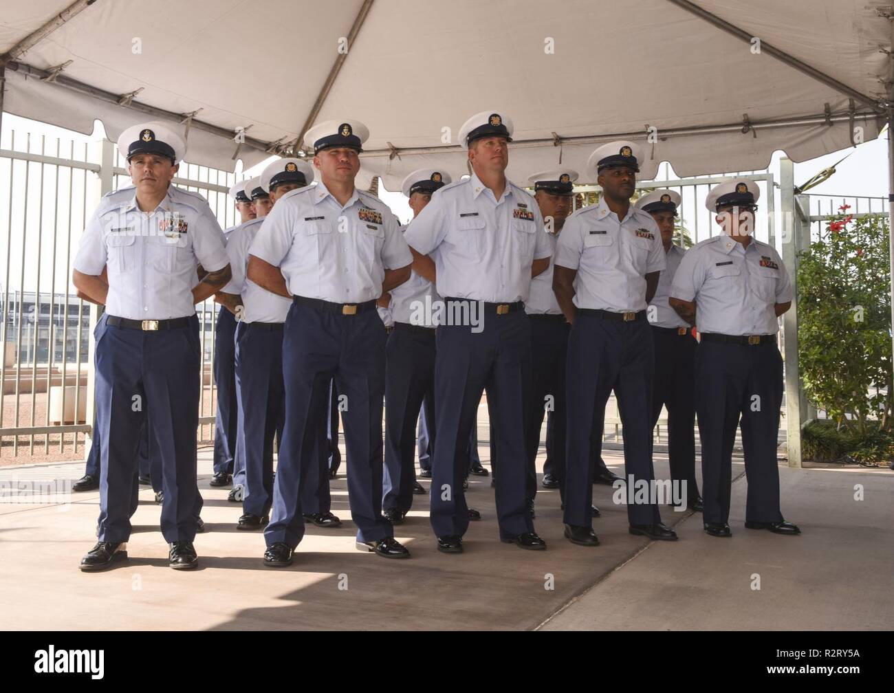 The crew of the  Coast Guard Forrest Rednour (WPC-1129) stands at parade rest during  the Forrest Rednour's Commissioning Ceremony in San Pedro, California, Nov. 8, 2018. The cutter is name after Petty Officer 2nd Class Forrest Rednour who assisted in the rescue of more than 130 service members on Feb. 3, 1943, during the attack go the SS DORCHESTER . Stock Photo