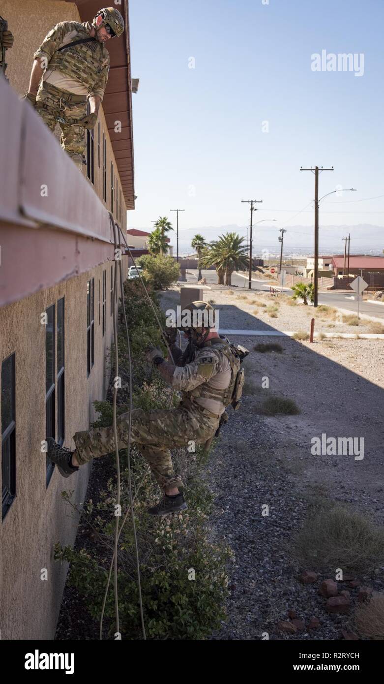 A pararescuemen from the 58th Rescue Squadron repels from a building