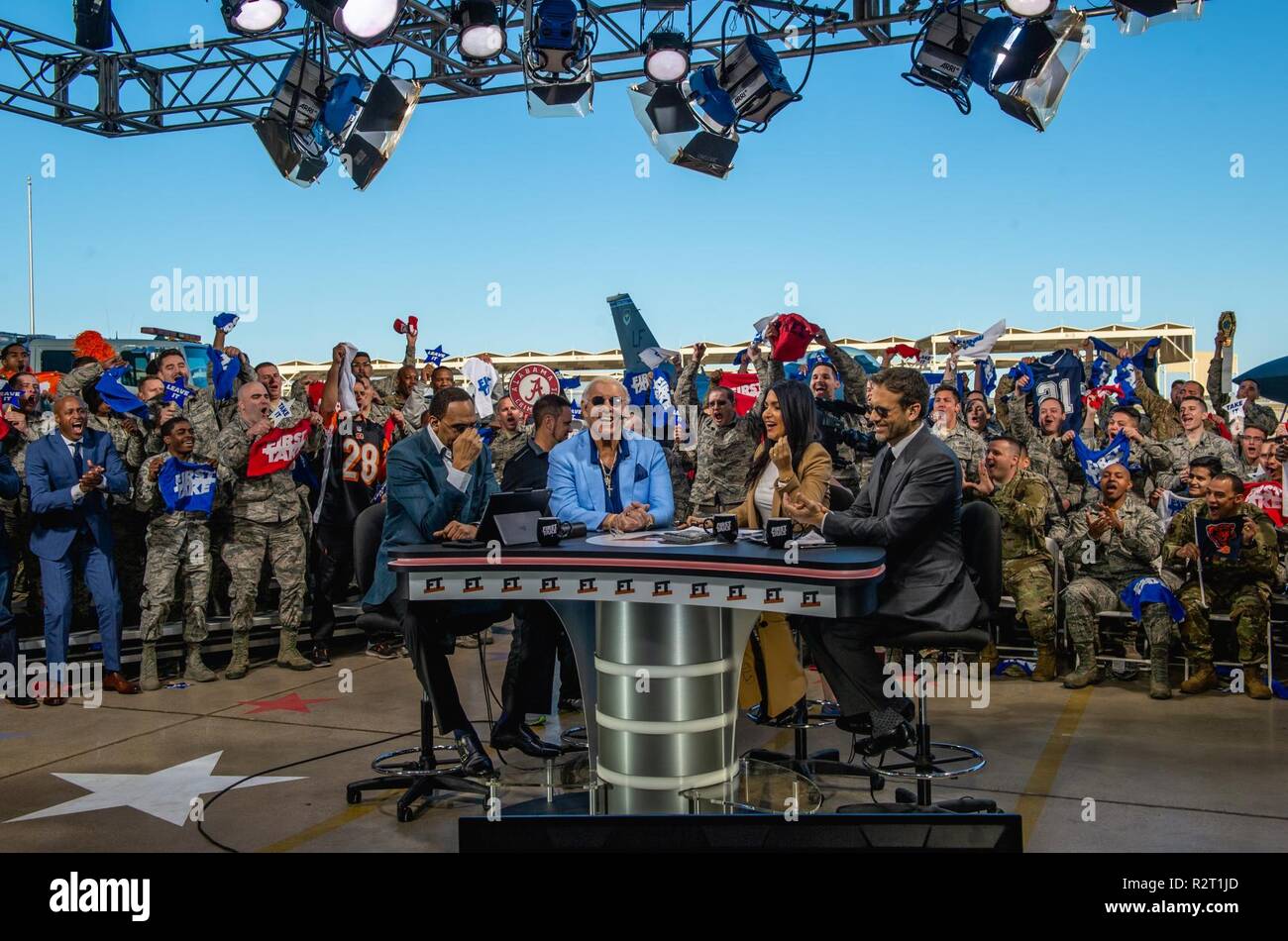 ESPN First Take hosts along with WWE Hall of Fame member “Nature Boy” Ric Flair discuss sports during a live show at Luke Air Force Base, Ariz., Nov. 9, 2018. Flair was a special guest on the show as part of the Veteran’s Day special show which honored military service members. Stock Photo
