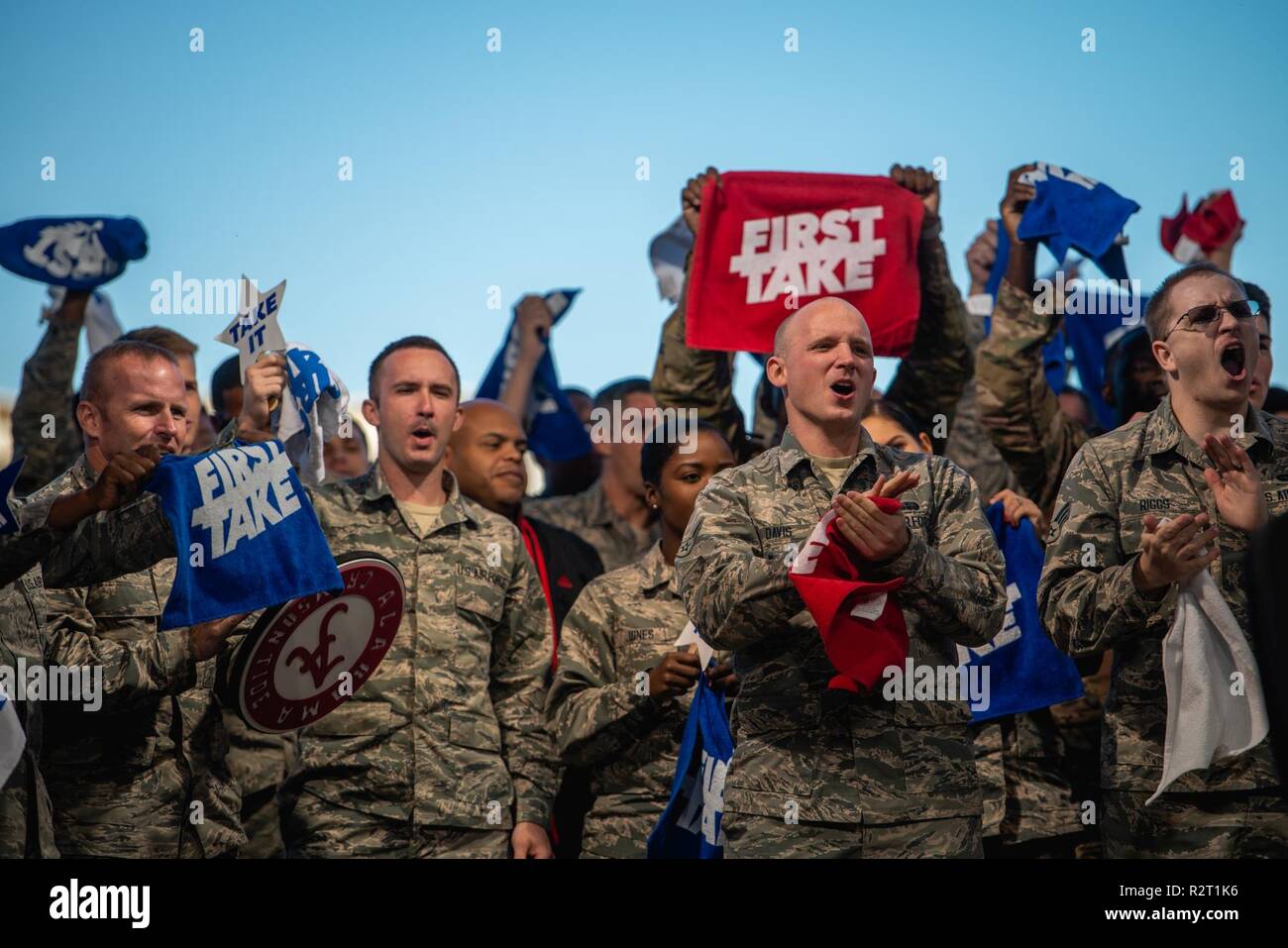 Thunderbolts cheer during an ESPN First Take live show at Luke Air Force Base, Ariz., Nov. 9, 2018. Airmen had the opportunity to interact with show hosts by asking questions about various sports topics. Stock Photo