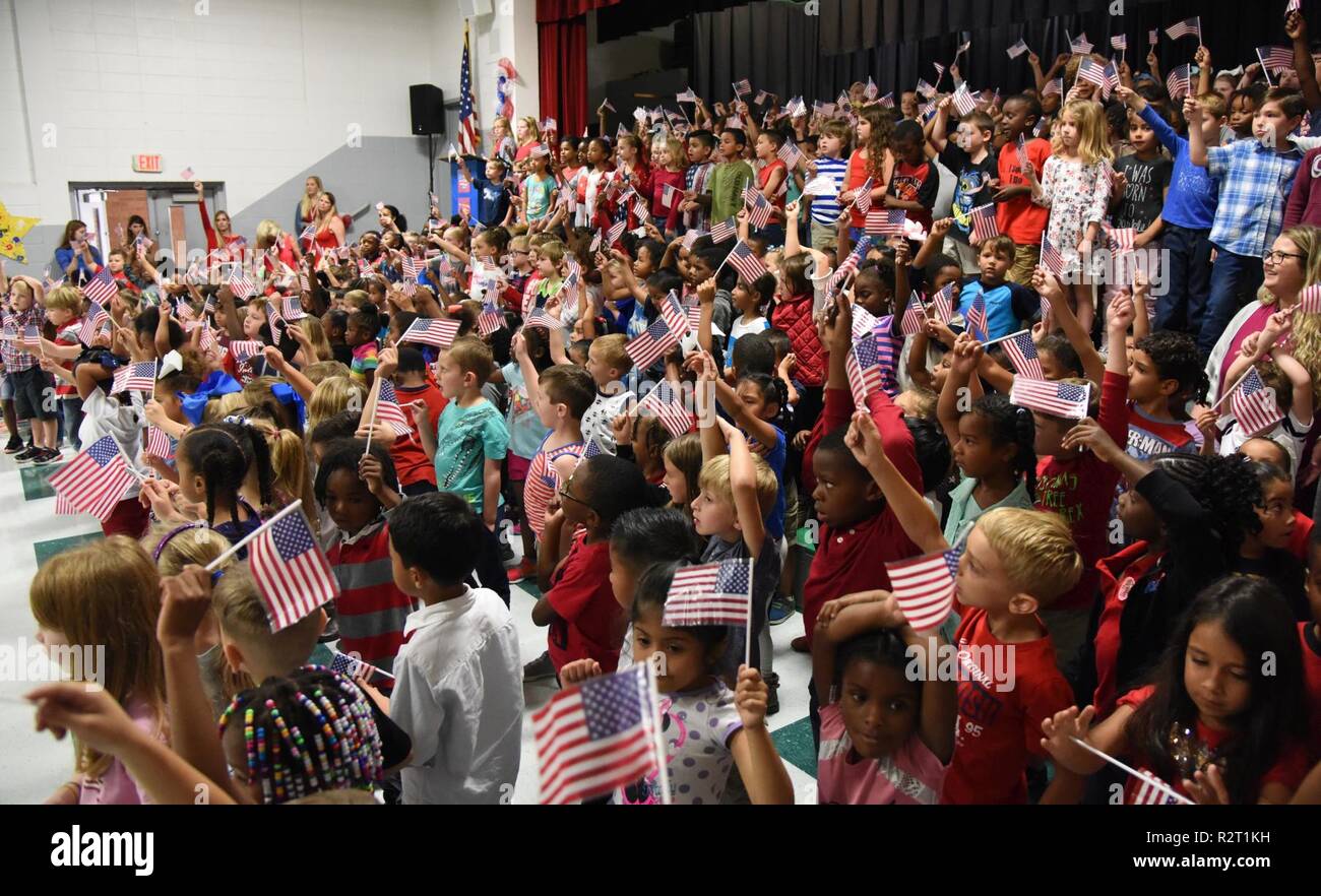 Students at Jeff Davis Elementary School sing patriotic songs during a