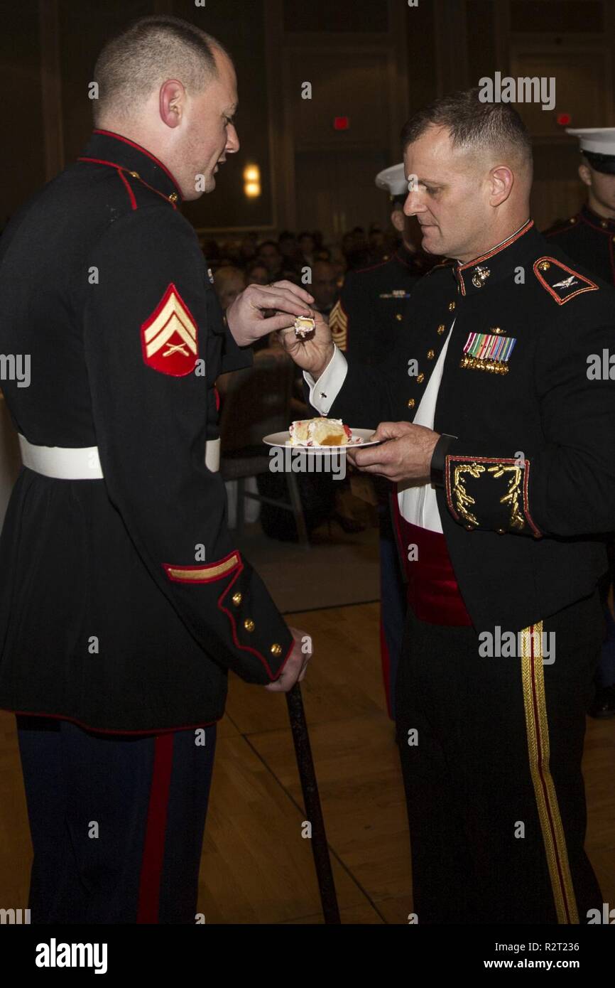Col. Sean C. Killeen, commanding officer of Headquarters Service Battalion hands the first piece of the birthday cake to Cpl. Matthew Bradford (Ret.) in the cake cutting ceremony during the units Marine Cops Birthday Ball celebration on Hilton Head Island, Nov. 9. Headquarters and Service Battalion is the parent command for personnel who provide continuous support to the depot and its subordinate commands in order to accomplish the depot’s mission of “Making Marines.” Stock Photo