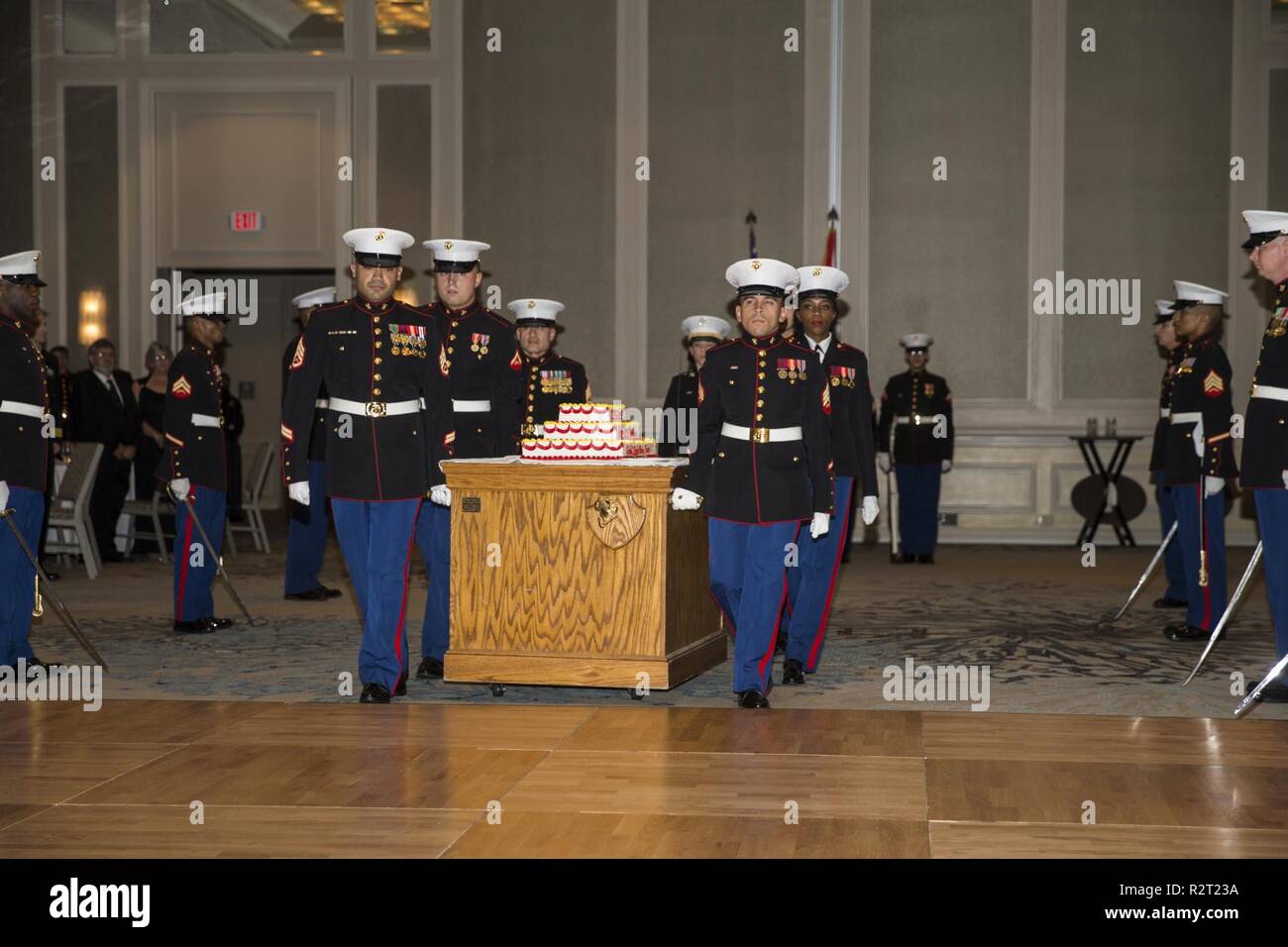 Marines with Headquarters Service Battalion escort the birthday cake for the cake cutting ceremony during the units Marine Cops Birthday Ball celebration on Hilton Head Island, Nov. 9. Headquarters and Service Battalion is the parent command for personnel who provide continuous support to the depot and its subordinate commands in order to accomplish the depot’s mission of “Making Marines.” Stock Photo