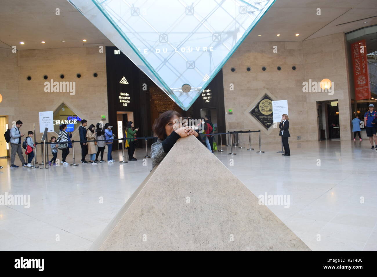 Tourists, Interior view of inverted pyramid in the Musee Du Louvre Paris France Stock Photo