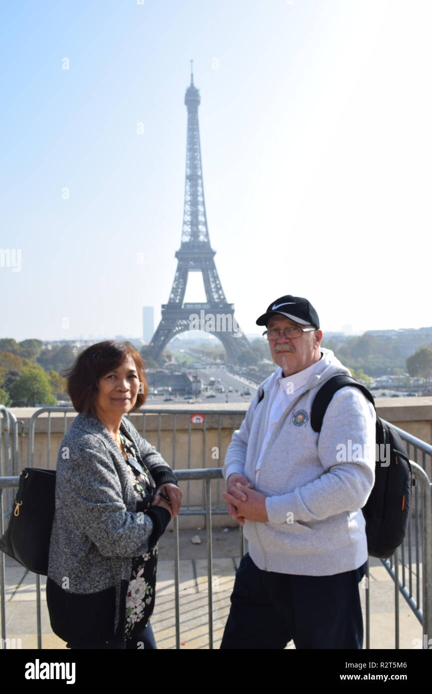 Senior citizen taken an iconic view with the Eiffel Tower in the background from the terrace at Trocadero Paris, France Stock Photo